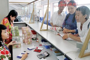 Thu ngân sách về đích, DN thêm sức ép?